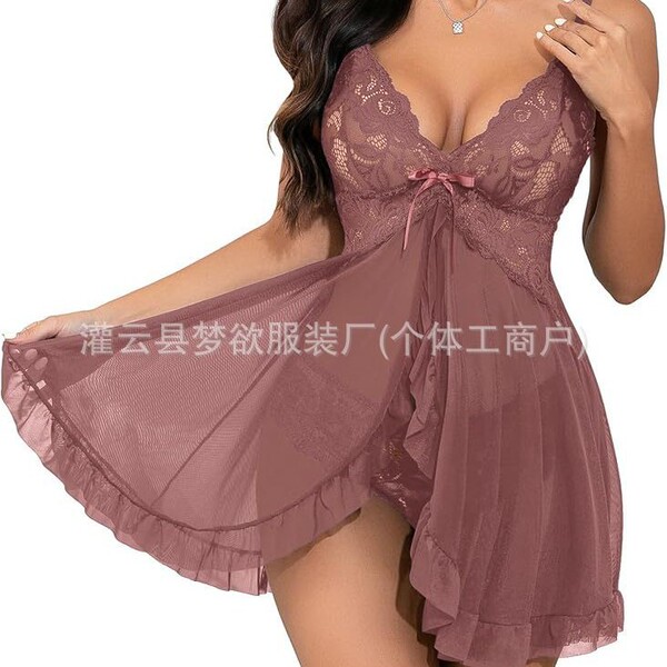 Woman wearing a dusty rose lace and mesh sleep set with cami top and shorts.