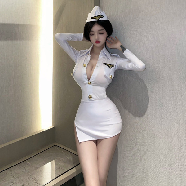Woman wearing white flight attendant cosplay costume with gold buttons and hat, posing in sexy ol secretary lingerie outfit.