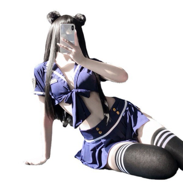 Woman in sexy police uniform lingerie set with skirt, posing for selfie. role play costume, seductive & easy-on design.