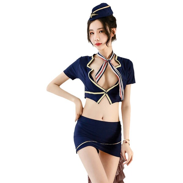 Woman modeling navy blue air hostess costume set with cropped top, bodycon skirt, and hat for adult role play.