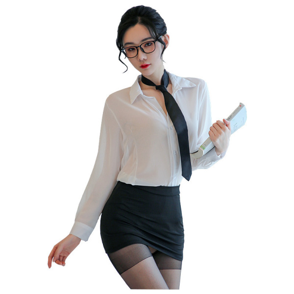 Woman wearing sheer white blouse, black tie, pencil skirt, and stockings holding a book.
