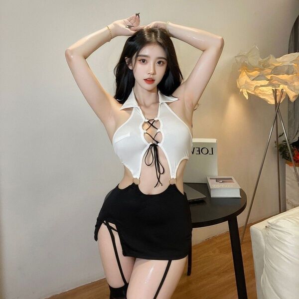 Woman modeling a sexy secretary ol costume set with a white cutout top and black bodycon skirt for role play.