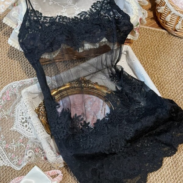 Black sheer lace bodysuit with floral embroidery, styled as a provocative bodycon slip dress for women.