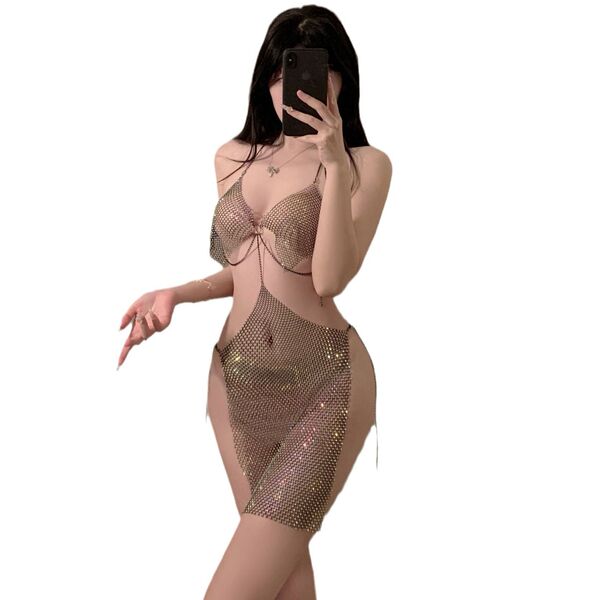 Woman wearing a sparkling sheer lace halter mini dress, perfect for nightclub parties and alluring evening events.