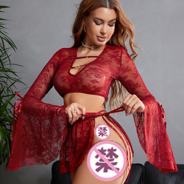 Woman modeling red sheer lace lingerie set with deep v, flared sleeves, and detachable ties — pure temptation sleepwear.