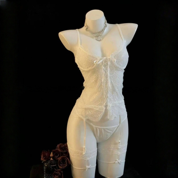 White lace push-up lingerie set with garter straps and matching panties on mannequin, perfect for midnight passion.