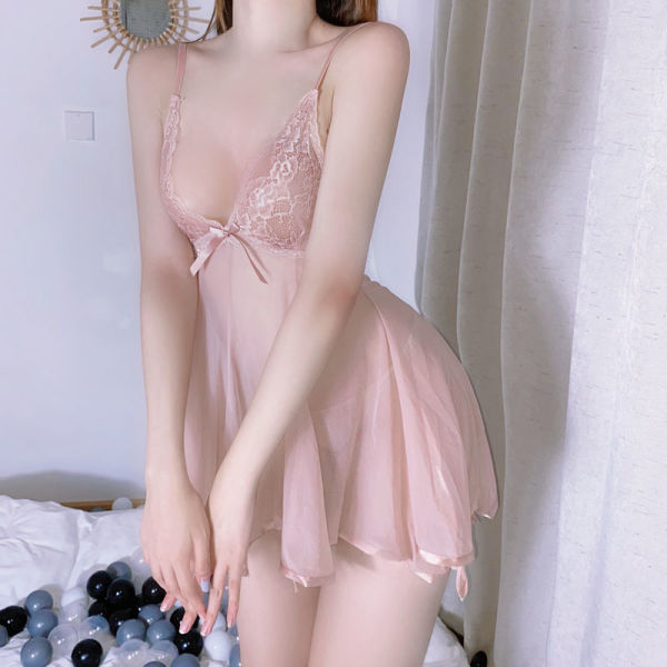 Woman wearing pink lace lingerie set with sheer nightgown, featuring delicate straps and bow detail, ideal for seductive slee...