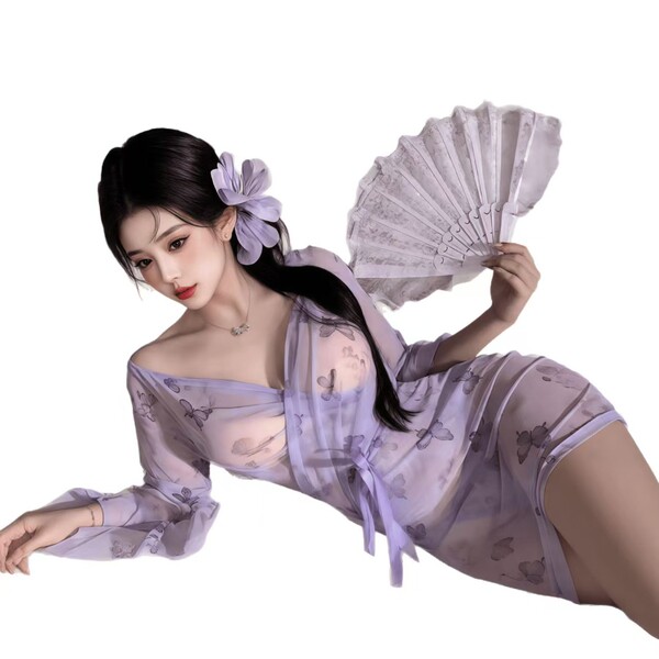 Woman in sheer lavender butterfly-print kimono robe, holding fan, wearing braless peek-a-boo sleepwear with floral hair acces...