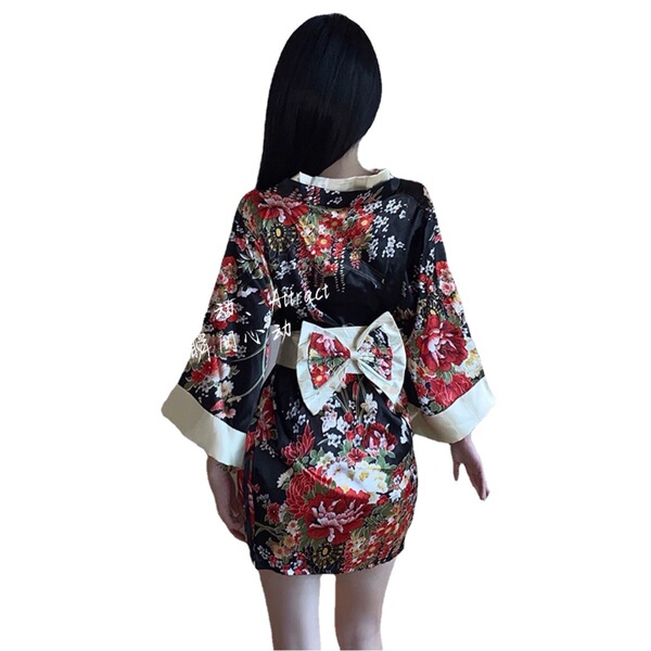 Front view of a black floral patterned japanese-style open front kimono with a bow tie, designed for role play and nightclub ...