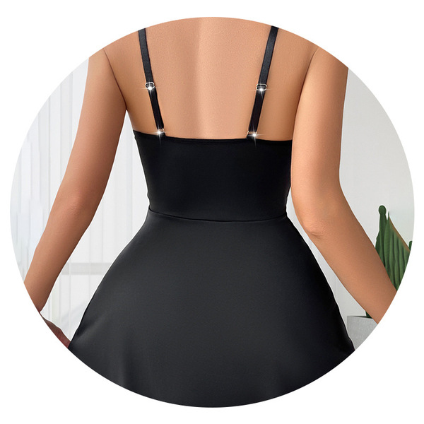 Solid black dress featuring lace trim, adjustable straps, and heart clasp detail.