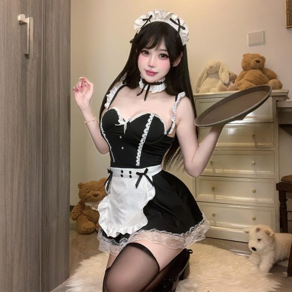 Woman wearing soul bond sexy nightgown - lace maid outfit with built-in pads, holding a tray in a cozy room.