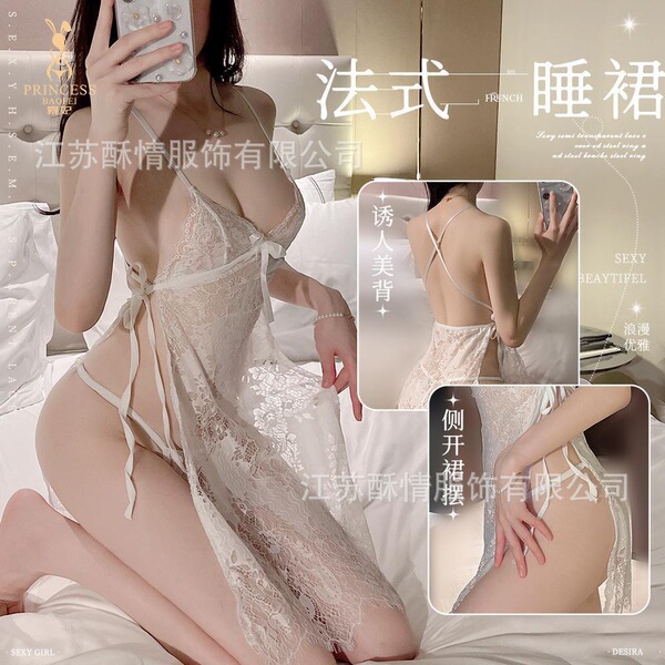 Woman modeling a sheer, lacy lingerie set with delicate straps and side slits. the sultry sheer lingerie set features a roman...