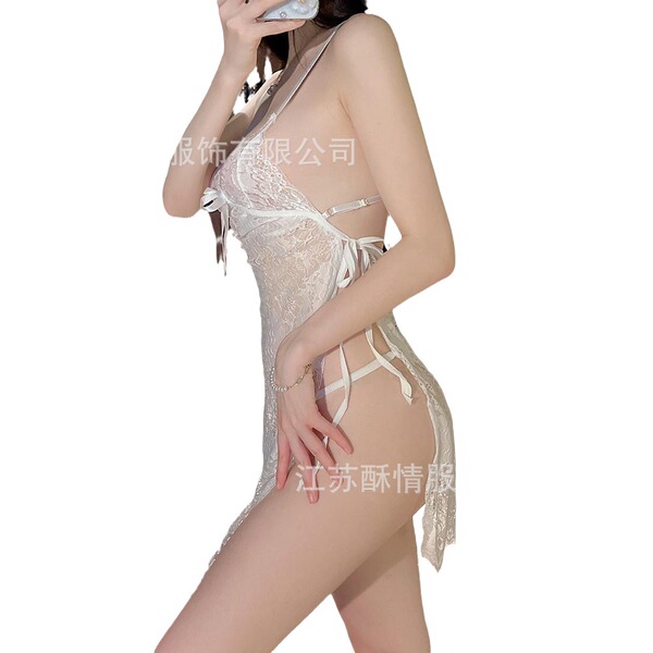 Woman modeling white lace lingerie set with sheer panels and delicate straps, perfect for romantic evenings.