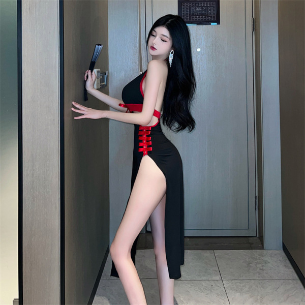 Woman in black sheer cheongsam lingerie with red accents and high slit, posing by a door. suoqing erotic role play outfit for...