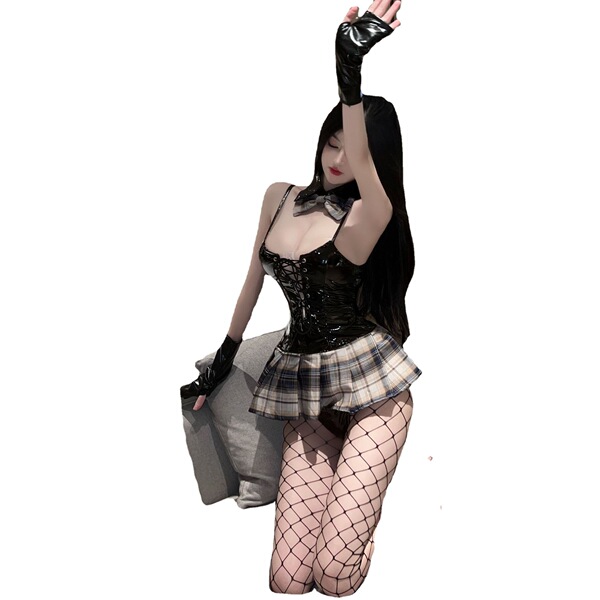 A stylish woman poses wearing a black mirror-finish corset top paired with a plaid skirt, fishnet stockings, and gloves, embo...