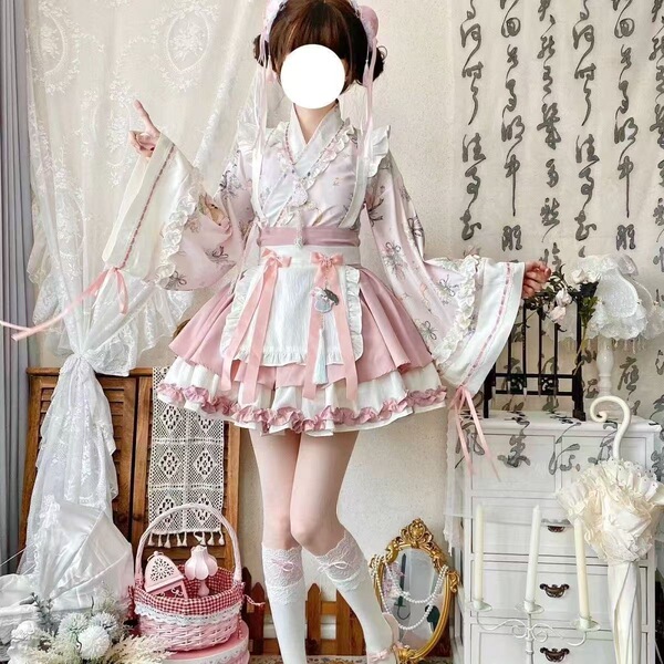 A woman models a sweet lolita maid dress set featuring a floral pattern, ruffled skirt, and apron, perfect for cosplay with a...