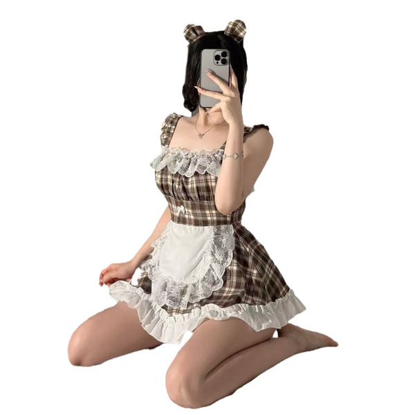 A woman poses in a plaid maid costume set, featuring a brown and white checkered dress with lace details and bear ears, perfe...