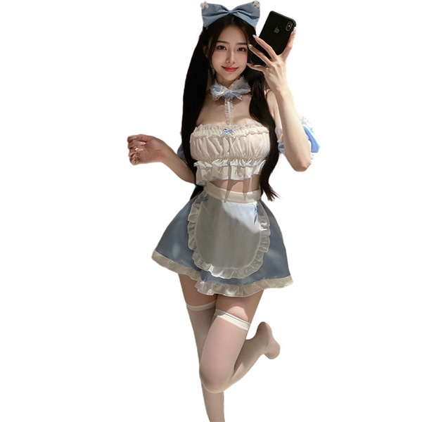 A woman poses wearing a charming sweetheart maid costume, featuring a pastel apron and bow headband, perfect for cosplay or t...