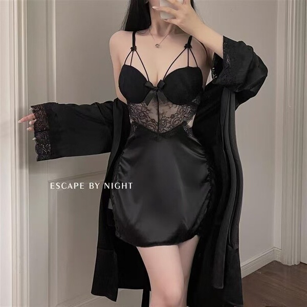 Woman wearing black transparent sexy lingerie set with sheer lace details and matching robe for couples play.