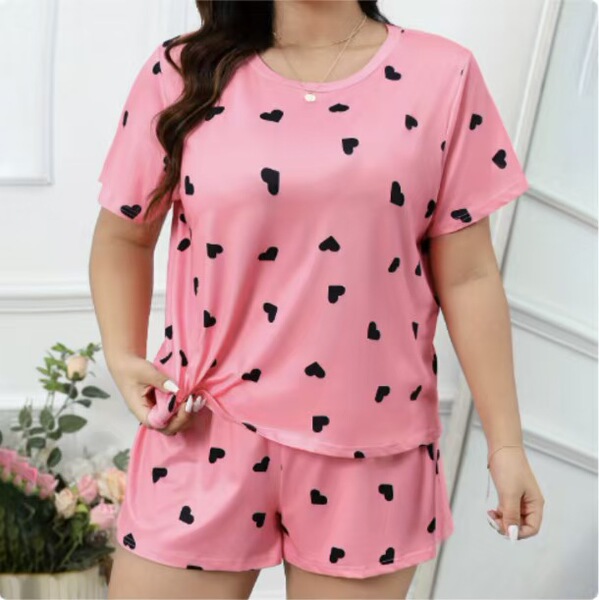 Trendy womens sexy print lounge set featuring a loose short sleeve top and shorts with playful black heart patterns, perfect ...