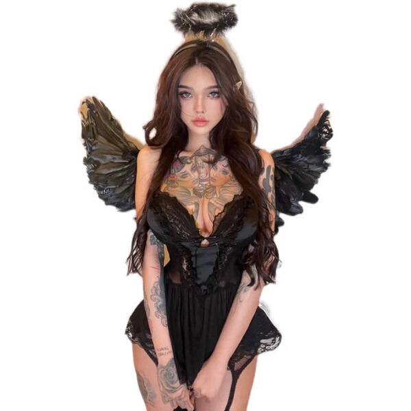 Woman wearing black lace sleep set with wings and tattoos, elegant romantic lingerie for couples.