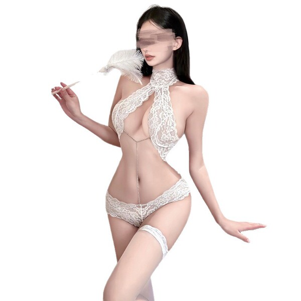 Woman wearing white lace bodysuit with push-up design, holding feather, minimalist elegant style.