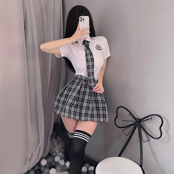 Womens seductive lingerie set - schoolgirl costume outfit, featuring a white blouse with plaid tie, black skirt, and knee-hig...