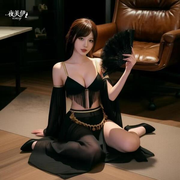 Woman in black luxury lingerie set with gold accents, posing elegantly on floor with feather fan — sensual, mature, alluring ...