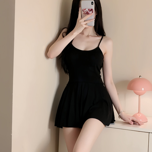 A woman poses with a black bodycon dress featuring a sexy backless design, high elasticity, and adjustable straps, creating a...