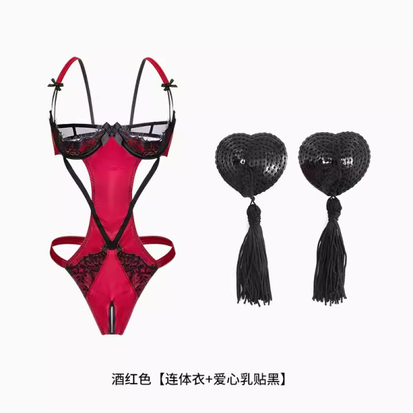 Womens sexy red lace bodysuit with open crotch, sheer bust, and black heart-shaped nipple pasties with tassels.