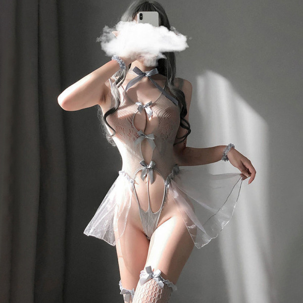 Woman wearing sheer lace bodysuit with puff sleeves and bow details, part of romantic lingerie nightwear set.