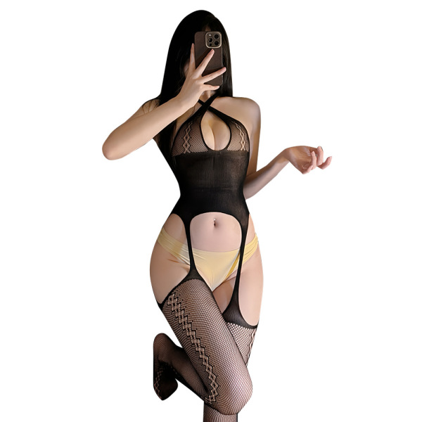 Woman wearing black vintage lace mesh bodystocking with floral embroidery, sheer full-body net design, and yellow underwear.