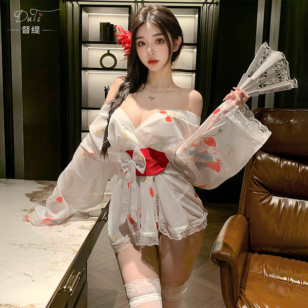 A woman poses elegantly in a sheer kimono-inspired uniform featuring floral prints, designed for a no-remove experience. the ...