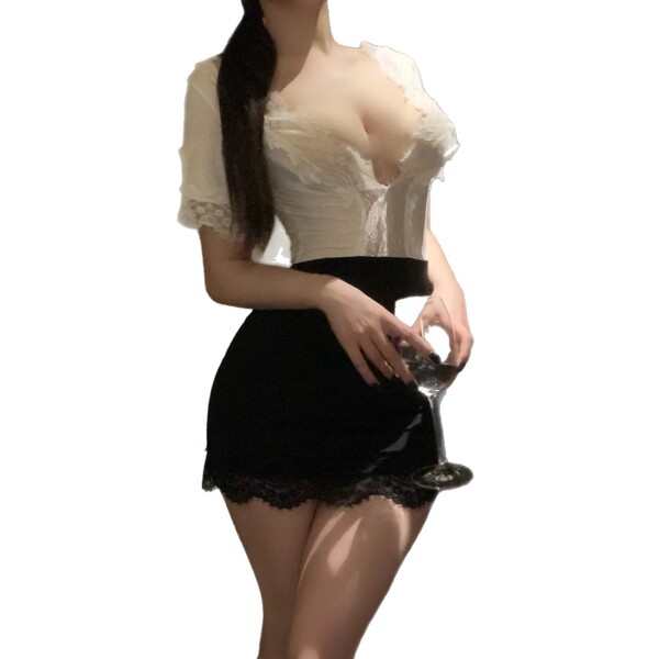 Woman wearing yaqin nu lingerie set with lace top and bodycon skirt, holding wine glass for date night.