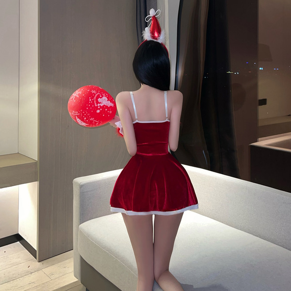 Sexy low-cut v-neck slip dress with festive santa hat, perfect for new year and christmas celebrations.
