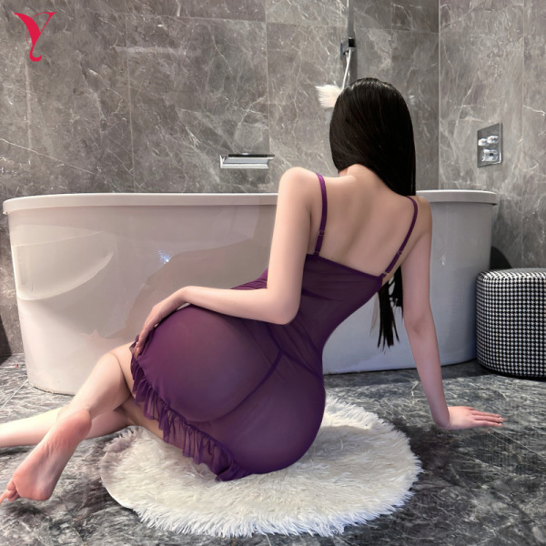 Woman in purple yese yese sensual lingerie dress – sheer mesh bodycon corset slip with adjustable straps, seated on rug near ...