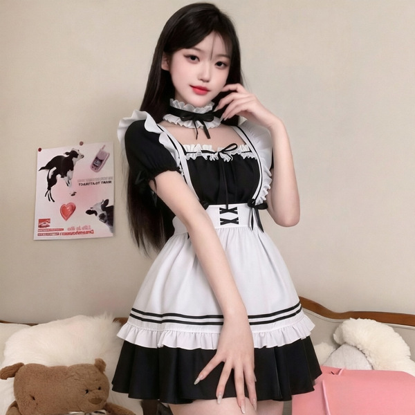 A woman models the yimenglan maid costume dress, featuring a black and white design with ruffles and a bow tie, perfect for c...