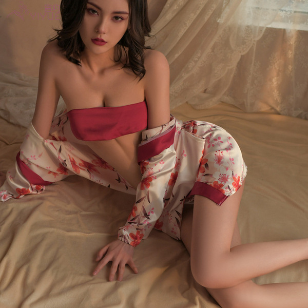 A woman poses in a bold floral print japanese-style kimono lingerie set, featuring an open-front design perfect for bedroom p...