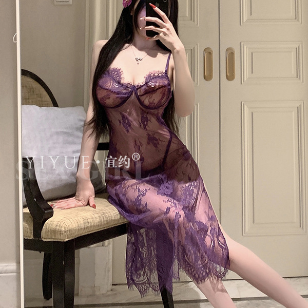 A woman poses in a sheer high-slit sleepwear, featuring purple lace and underwire push-up support, ideal for women seeking el...