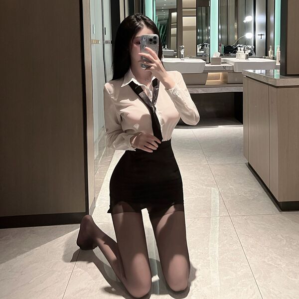 A woman poses in a bathroom wearing a yujie-style secretary sexy pure-yu summer shirt set, featuring a slim-fit design with a...