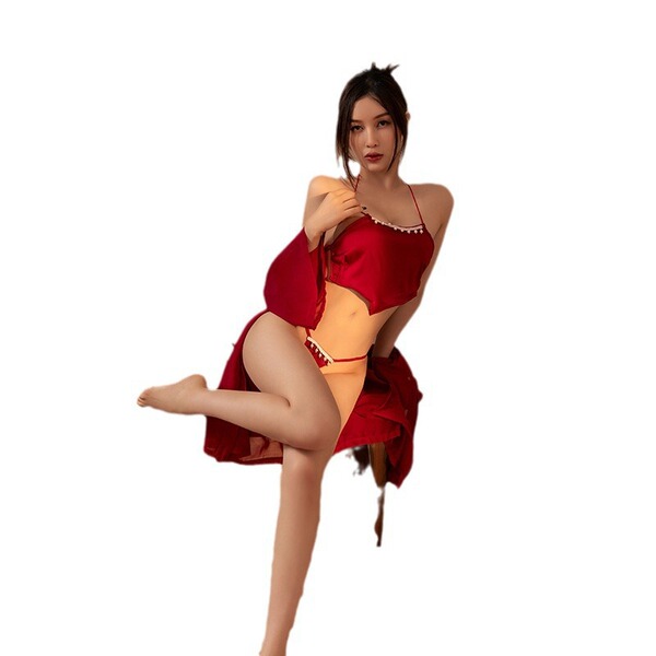 A woman poses elegantly in a red silk bodysuit, featuring a sheer veil and sensual design, perfect for new year romance.