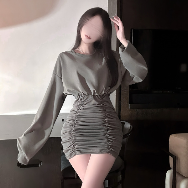 Woman wearing a hong kong style flirty pleated mini skirt with sensual bodycon fit and lace trim corset waistline.