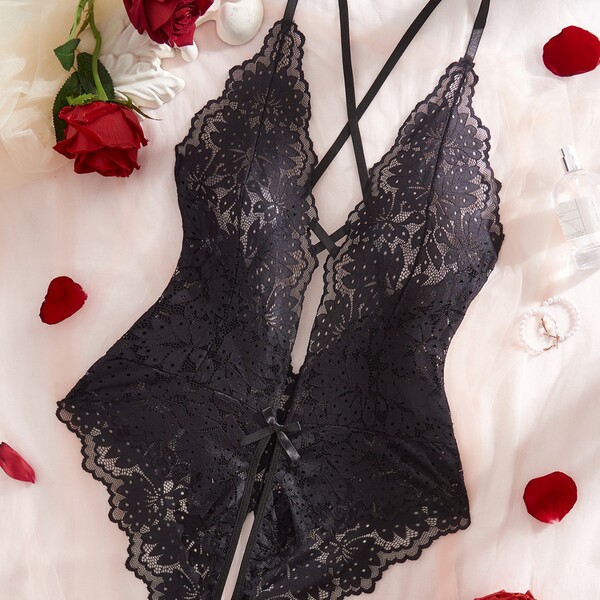 Luxury lace bodysuit featuring sheer elegance with intricate floral patterns, perfect for women seeking stylish and elegant f...