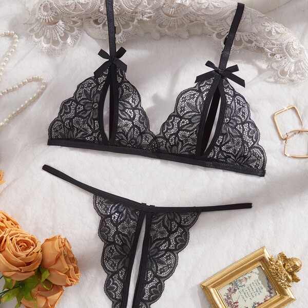 Lace sleepwear set featuring intricate black lace design with bows, perfect for women seeking elegant european-american style...