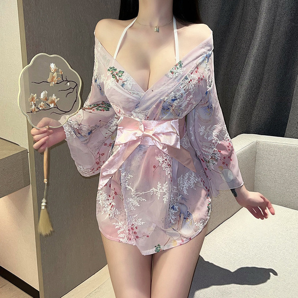 A woman wears a plus-size japanese-style sexy kimono robe featuring floral prints, a bow detail, and elegant design, perfect ...