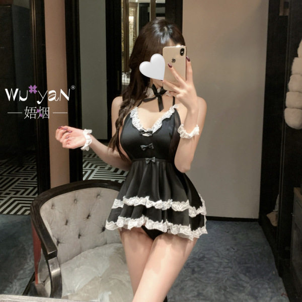 Woman in black lace maid-style sleep dress with white trim, posing in mirror selfie; romantic bedroom lingerie set.