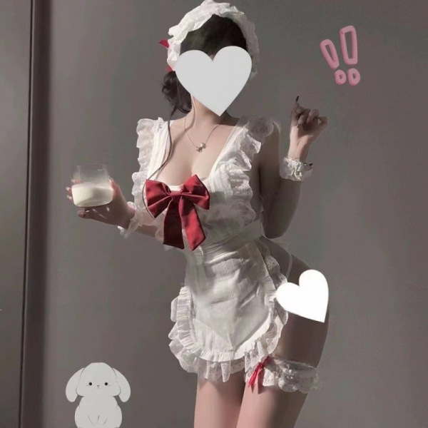 Woman in white plus size maid-inspired lingerie set with red bow, holding milk glass. pure & alluring kawaii sleepwear.