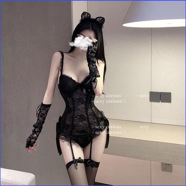 Woman modeling black lace lingerie set with sheer mesh bodysuit, garter stockings, and cat ears.