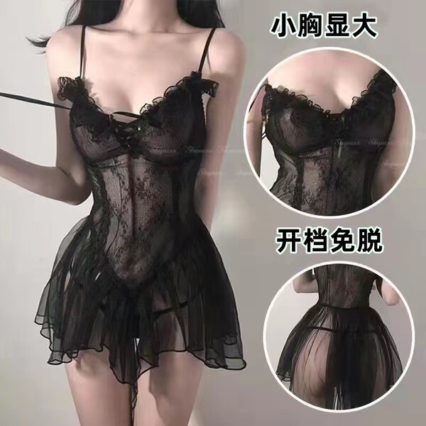 Woman wearing black sheer lace camisole and backless slip dress with ruffled hem, featuring bust-enhancing design and open-cr...