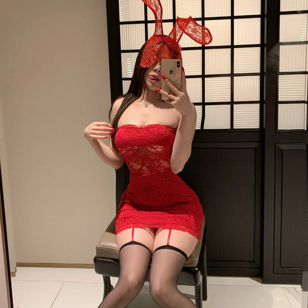 Sensual lace off-shoulder corset dress with cutouts, perfect for date night. red sheer design, black stockings, bunny ears he...